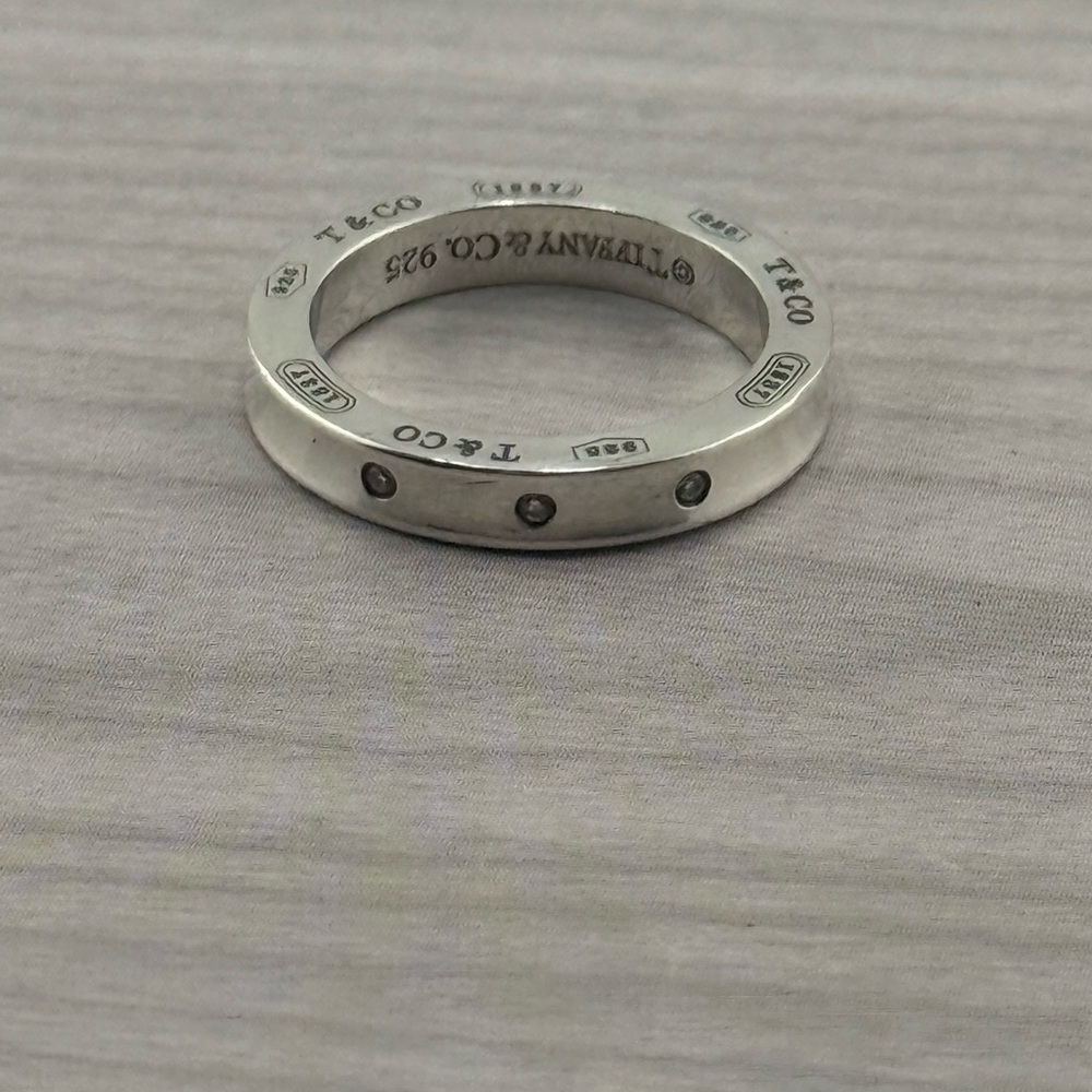 Tiffany & Co. Silver Ring with Modern Design and 3 Diamond Embellishments